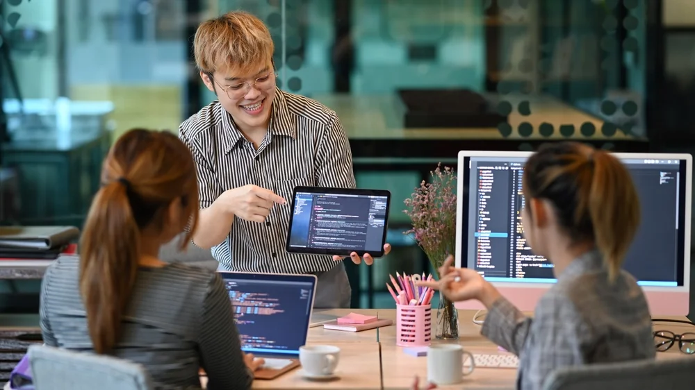 Web development team in Australia planning and coding a custom project together