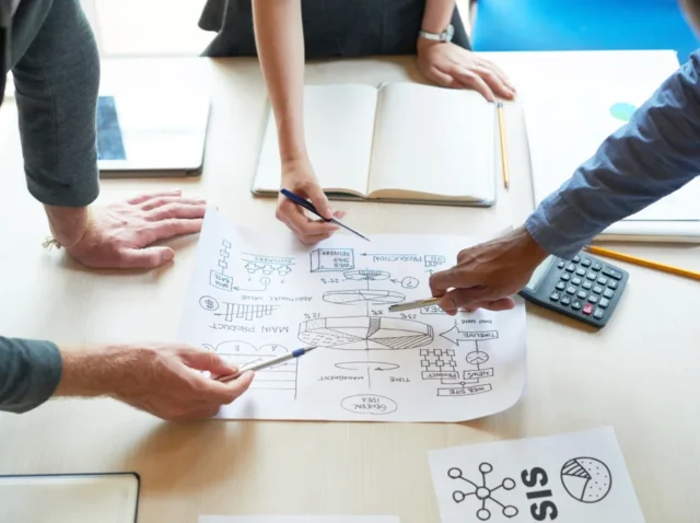 Business team planning strategy at a web development agency in Australia