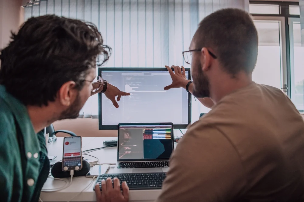Team of developers collaborating on app design without real user feedback or testing.